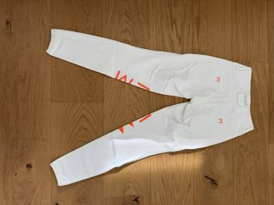 Pantalon d’équitation gem – blanc avec logo orange 