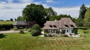 DOMAINE NORMAND COMPOSÉ DE TROIS MAISONS SUR UN PARC ARBORÉ DE